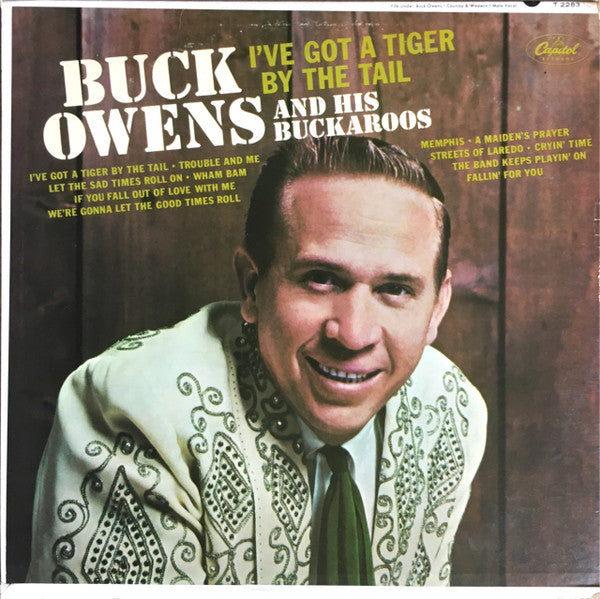 Buck Owens And His Buckaroos - I've Got A Tiger By The Tail